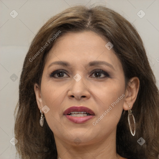 Joyful white adult female with long  brown hair and brown eyes