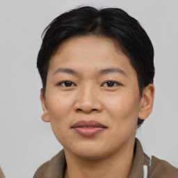 Joyful asian young-adult female with short  brown hair and brown eyes