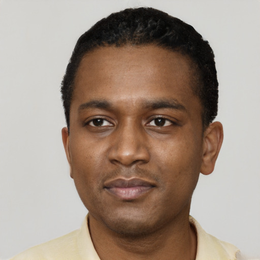 Neutral black young-adult male with short  black hair and brown eyes