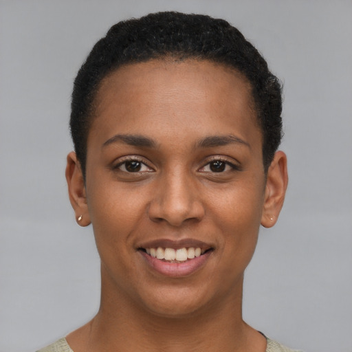 Joyful black young-adult female with short  brown hair and brown eyes