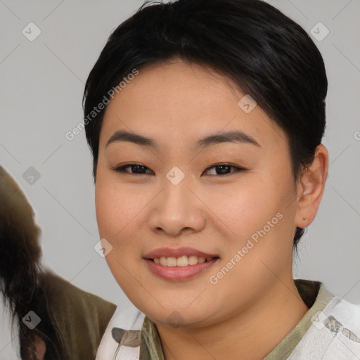 Joyful asian young-adult female with medium  brown hair and brown eyes