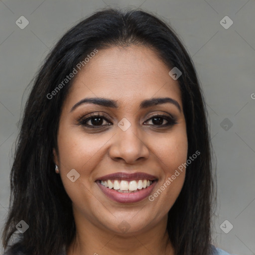 Joyful latino young-adult female with long  brown hair and brown eyes