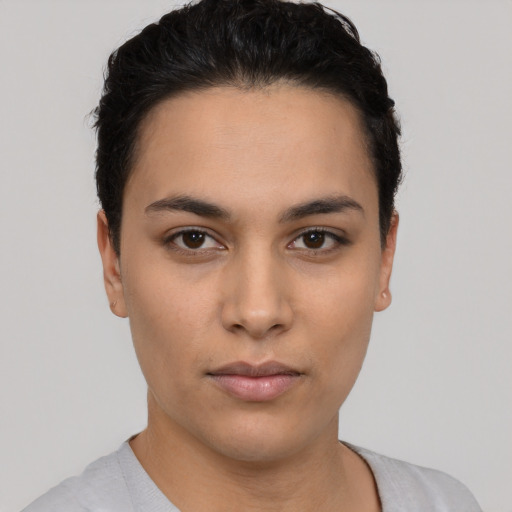 Neutral white young-adult female with short  black hair and brown eyes