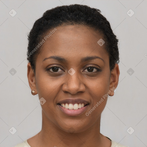 Joyful black young-adult female with short  black hair and brown eyes