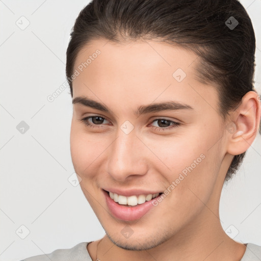 Joyful white young-adult female with short  brown hair and brown eyes