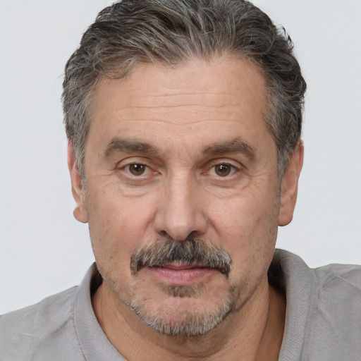 Joyful white middle-aged male with short  brown hair and brown eyes