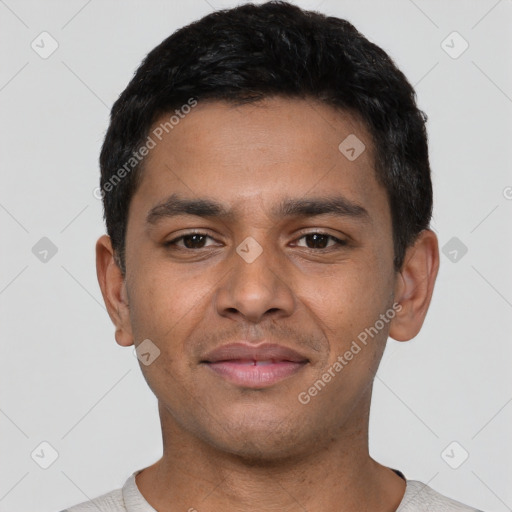 Joyful latino young-adult male with short  black hair and brown eyes