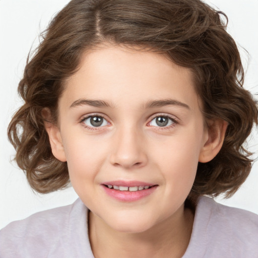 Joyful white child female with medium  brown hair and brown eyes