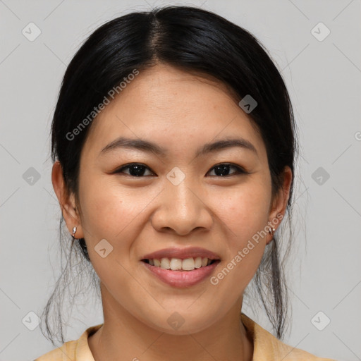 Joyful asian young-adult female with medium  brown hair and brown eyes