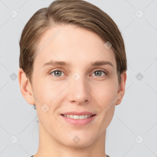 Joyful white young-adult female with short  brown hair and grey eyes