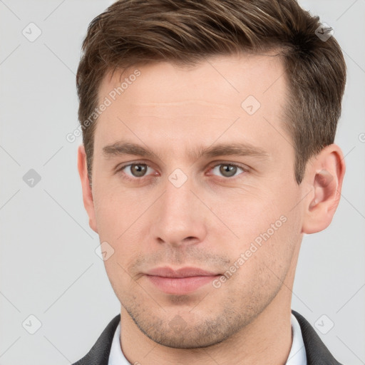 Neutral white young-adult male with short  brown hair and grey eyes