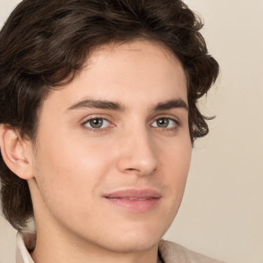 Joyful white young-adult male with medium  brown hair and brown eyes