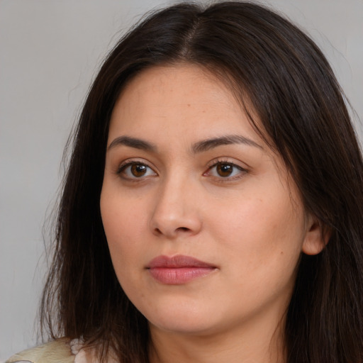 Neutral white young-adult female with long  brown hair and brown eyes