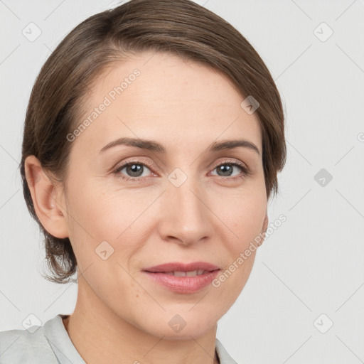 Joyful white young-adult female with medium  brown hair and grey eyes