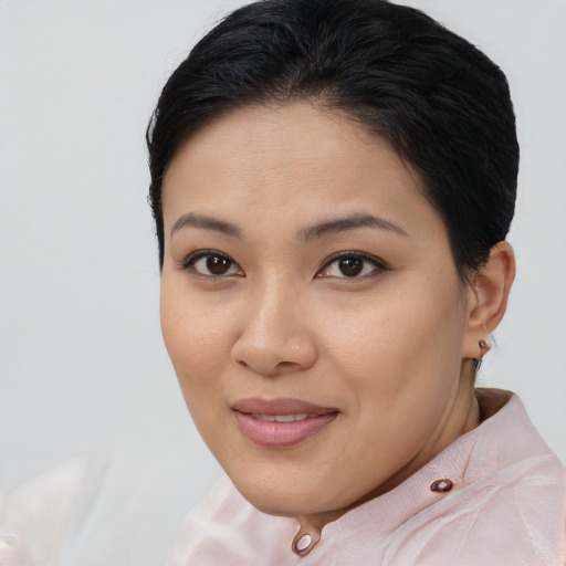 Joyful asian young-adult female with short  brown hair and brown eyes