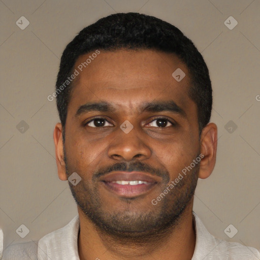 Joyful latino young-adult male with short  black hair and brown eyes