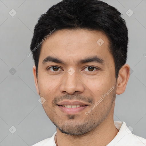 Joyful asian young-adult male with short  black hair and brown eyes