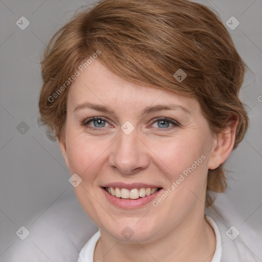 Joyful white adult female with medium  brown hair and blue eyes