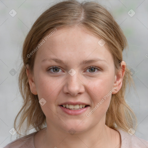 Joyful white young-adult female with medium  brown hair and blue eyes