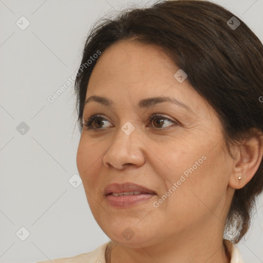 Joyful white adult female with medium  brown hair and brown eyes