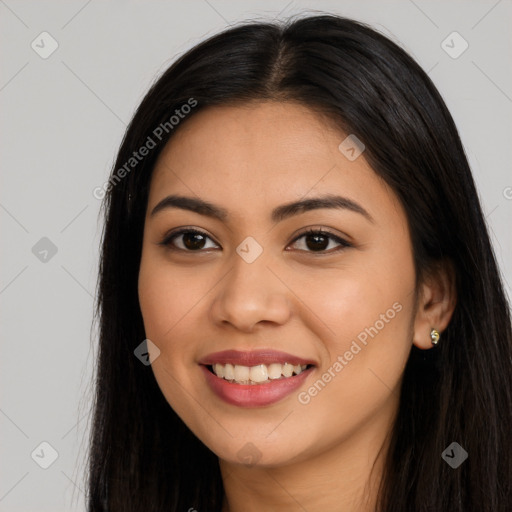 Joyful latino young-adult female with long  brown hair and brown eyes