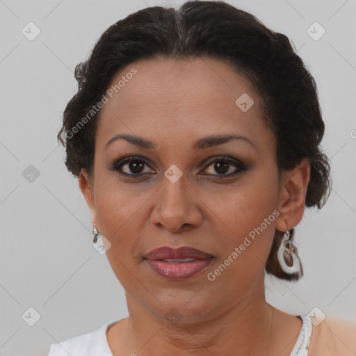 Joyful black adult female with short  brown hair and brown eyes