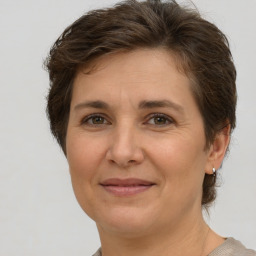 Joyful white adult female with short  brown hair and brown eyes