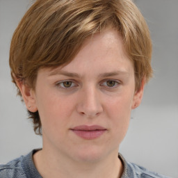 Joyful white young-adult female with medium  brown hair and blue eyes