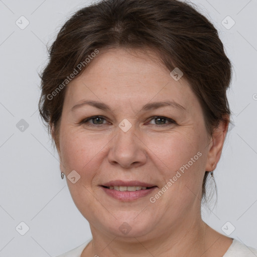 Joyful white adult female with short  brown hair and grey eyes