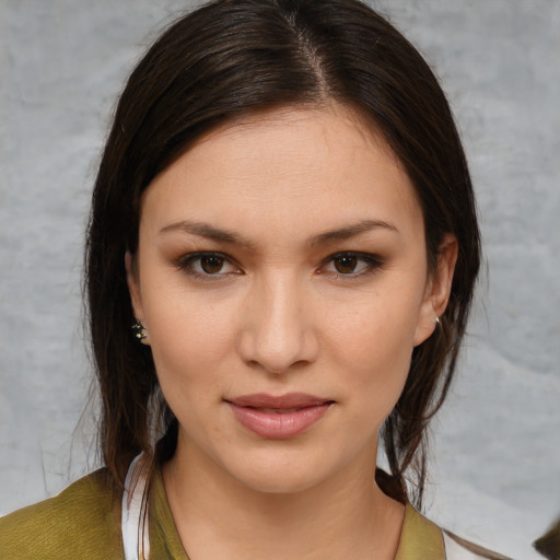 Joyful white young-adult female with medium  brown hair and brown eyes