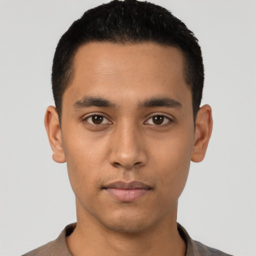 Neutral latino young-adult male with short  black hair and brown eyes