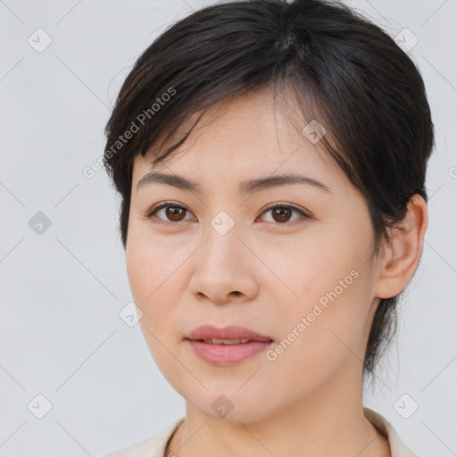 Joyful asian young-adult female with medium  brown hair and brown eyes