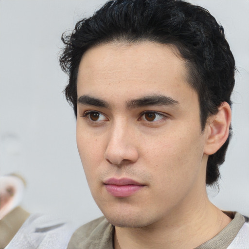 Neutral white young-adult male with short  black hair and brown eyes