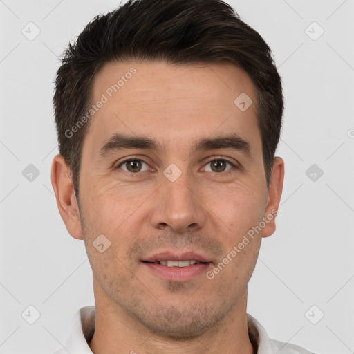 Joyful white adult male with short  brown hair and brown eyes