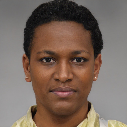 Joyful black young-adult female with short  brown hair and brown eyes