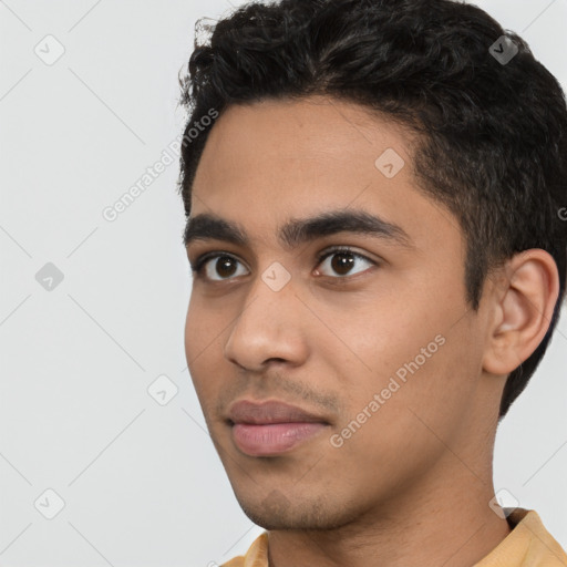 Neutral latino young-adult male with short  black hair and brown eyes