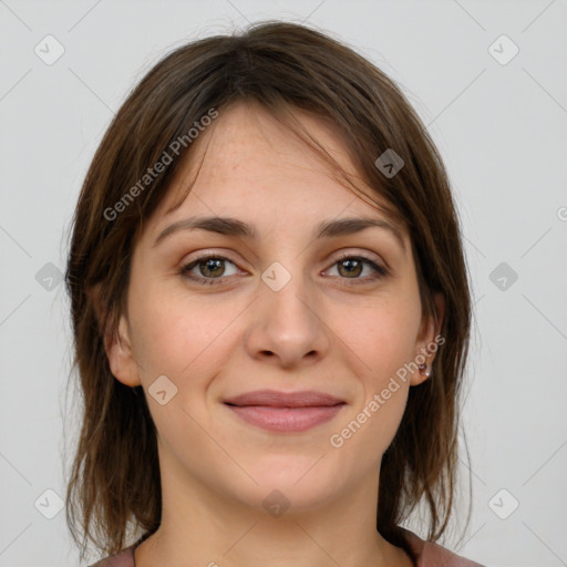 Joyful white young-adult female with medium  brown hair and grey eyes