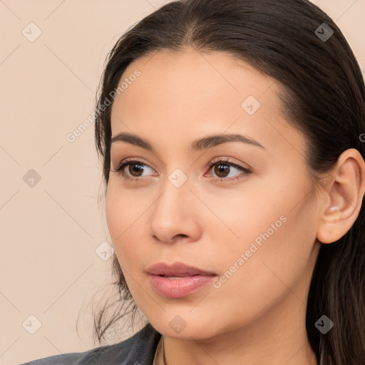 Neutral white young-adult female with long  brown hair and brown eyes