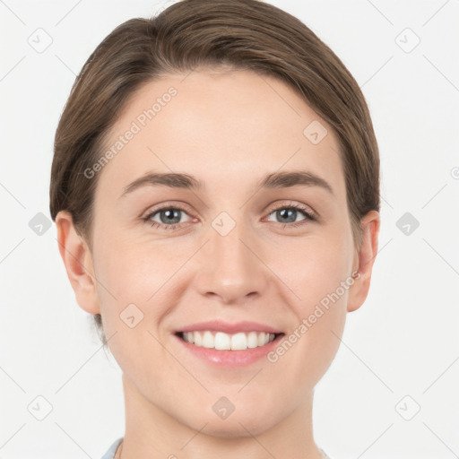 Joyful white young-adult female with short  brown hair and grey eyes