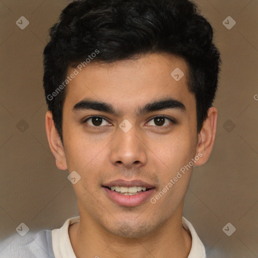 Joyful latino young-adult male with short  brown hair and brown eyes