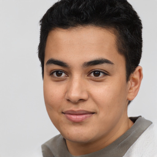 Joyful asian young-adult male with short  brown hair and brown eyes