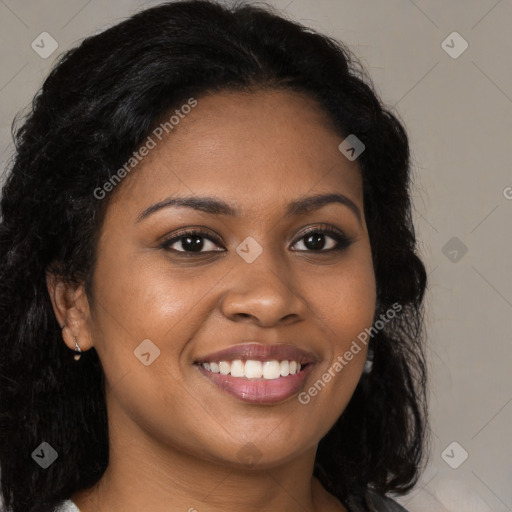 Joyful black young-adult female with long  brown hair and brown eyes