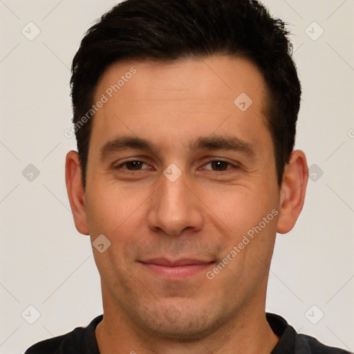 Joyful white young-adult male with short  brown hair and brown eyes