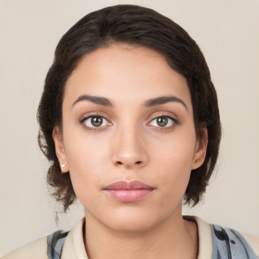 Neutral white young-adult female with medium  brown hair and brown eyes