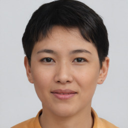 Joyful asian young-adult female with short  brown hair and brown eyes