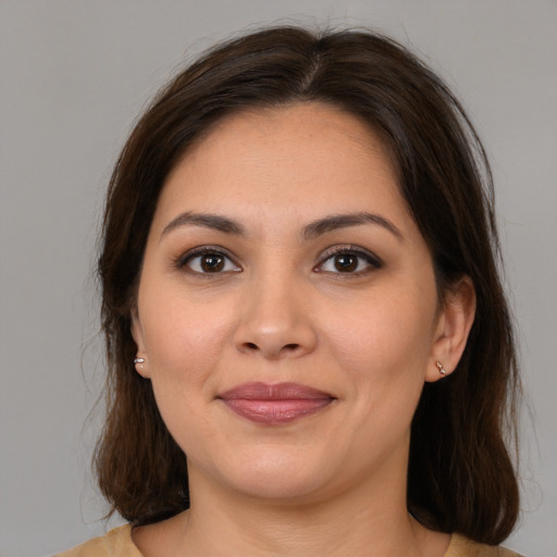 Joyful white young-adult female with medium  brown hair and brown eyes