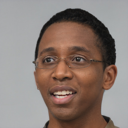 Joyful black young-adult male with short  black hair and brown eyes