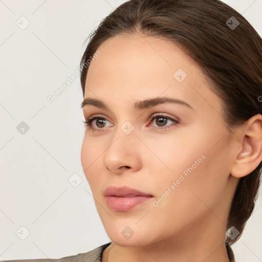 Neutral white young-adult female with long  brown hair and brown eyes