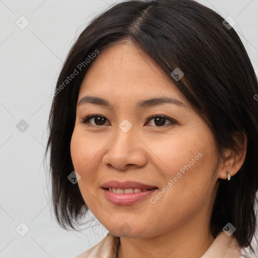 Joyful asian adult female with medium  brown hair and brown eyes