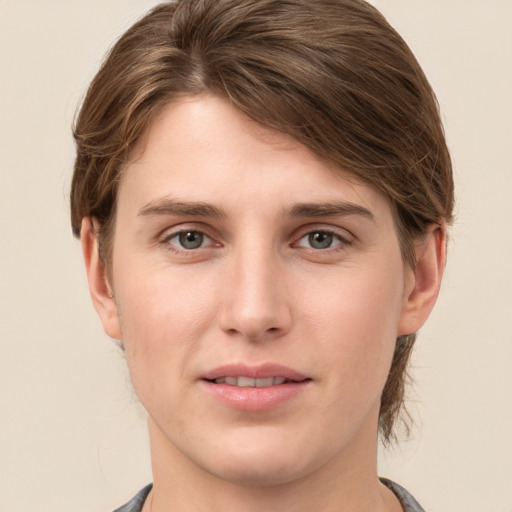 Joyful white young-adult female with medium  brown hair and grey eyes